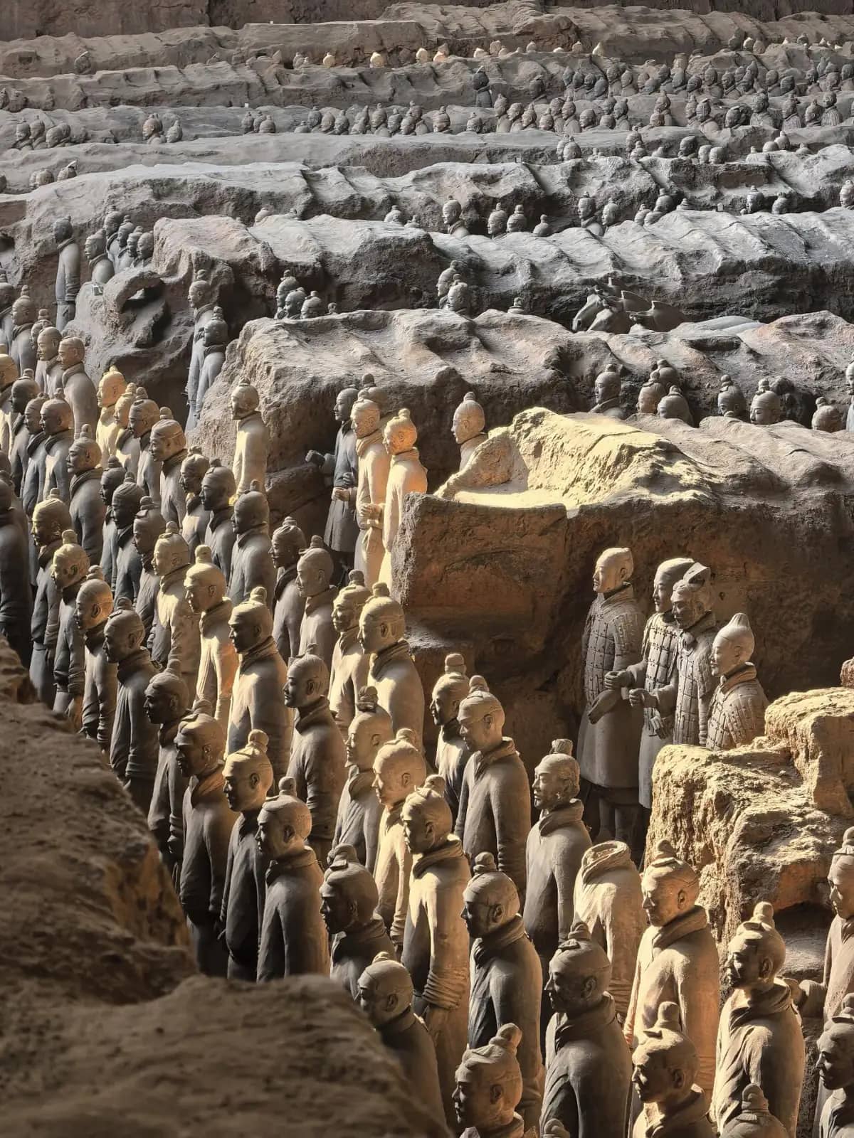 Rows of Terracotta Warriors inside the main excavation hall near Xi'an
