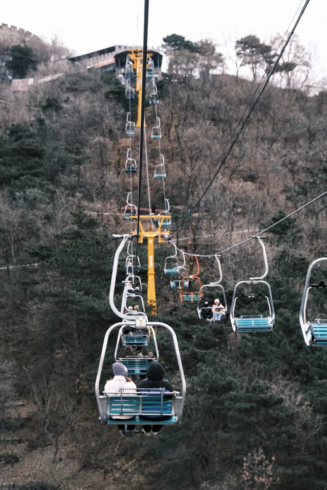 Travelers riding the open chairlift at Mutianyu Great Wall near Beijing