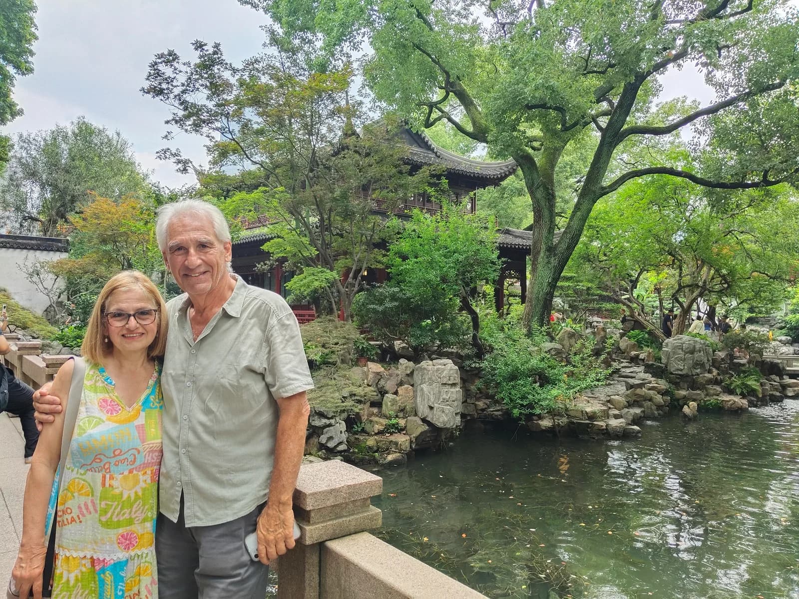 Older couple walking beside Yu Garden in Shanghai