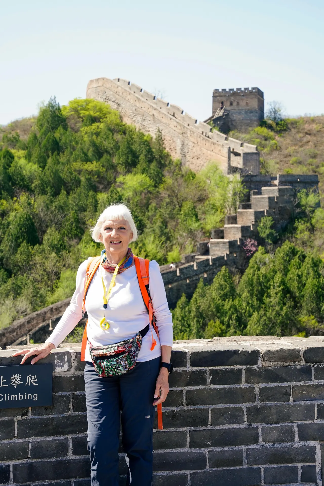 A traveler standing beside the Great Wall near Beijing