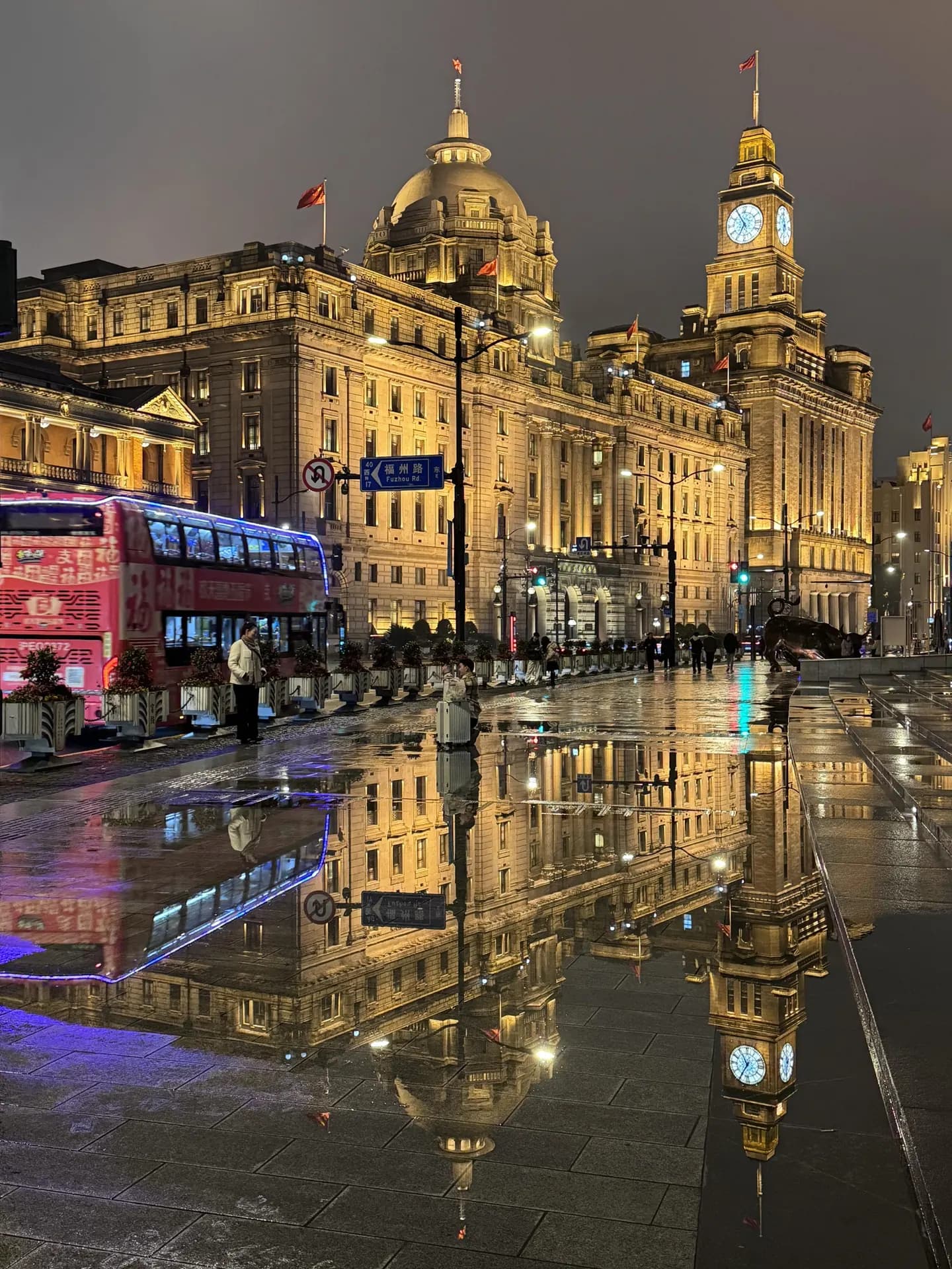 The Bund historic buildings illuminated beside the Huangpu River in Shanghai