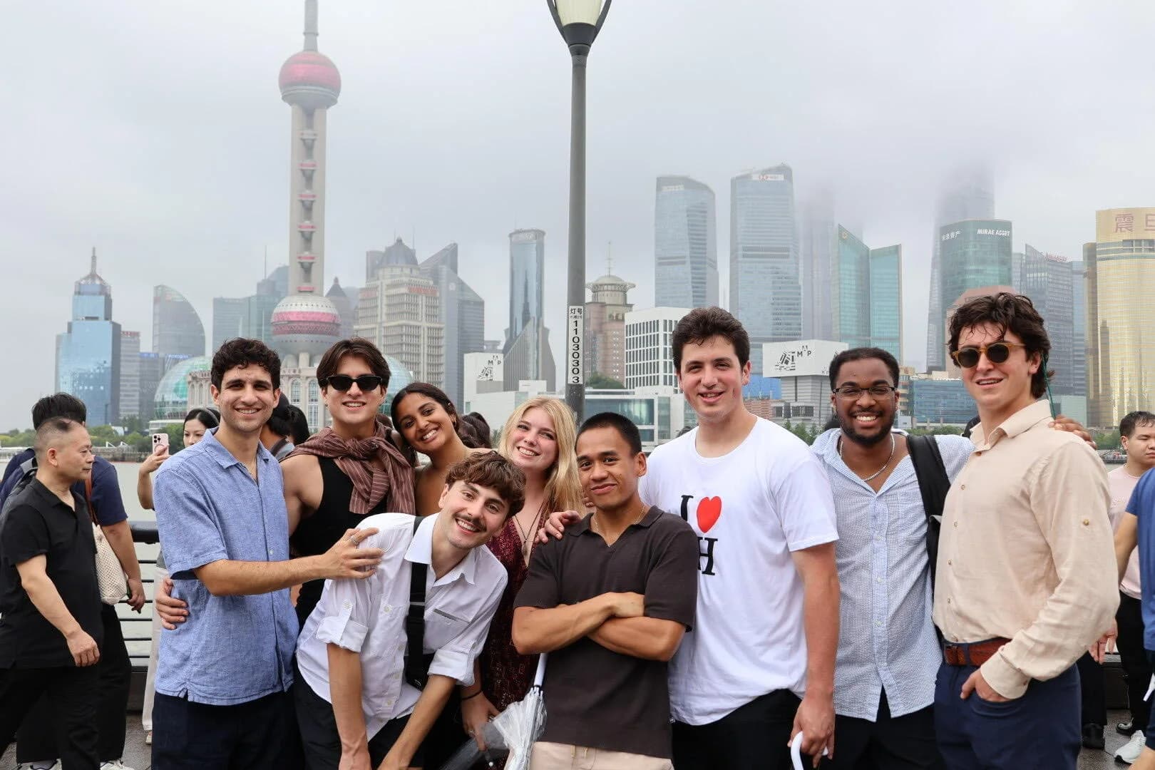International visitors on the Bund with the Shanghai skyline behind them