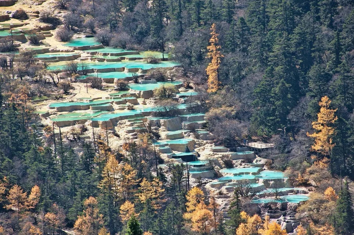 Huanglong mineral pools in Sichuan mountain scenery