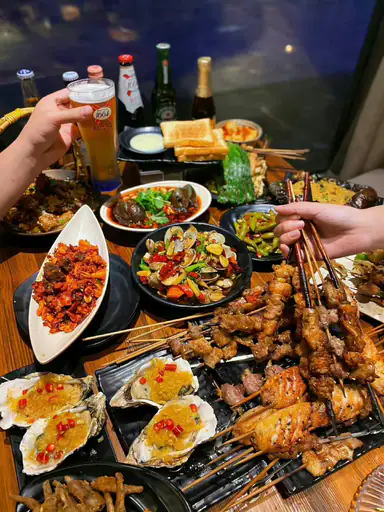 Travelers enjoying local dishes together in China